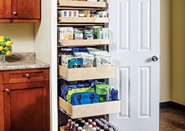 Pantry drawers full of items.