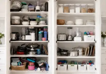 Kitchen cabinets full of items.