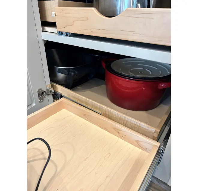 Cabinet with red bowl.