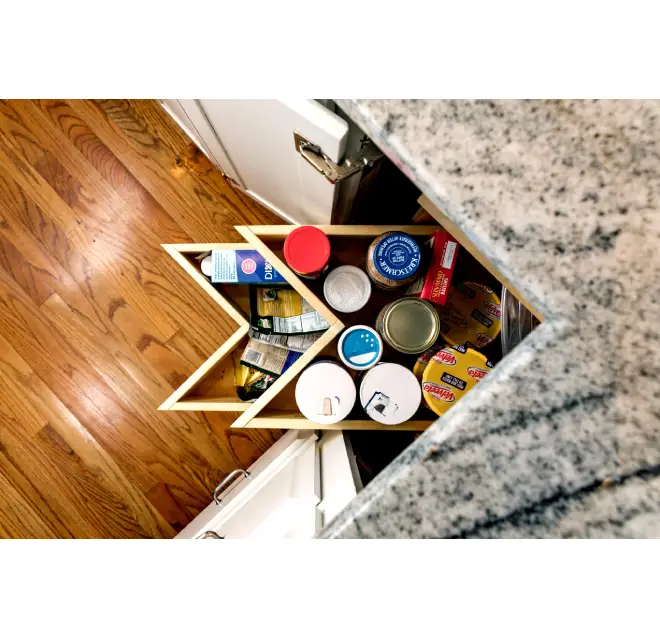 Corner cabinet with items inside.