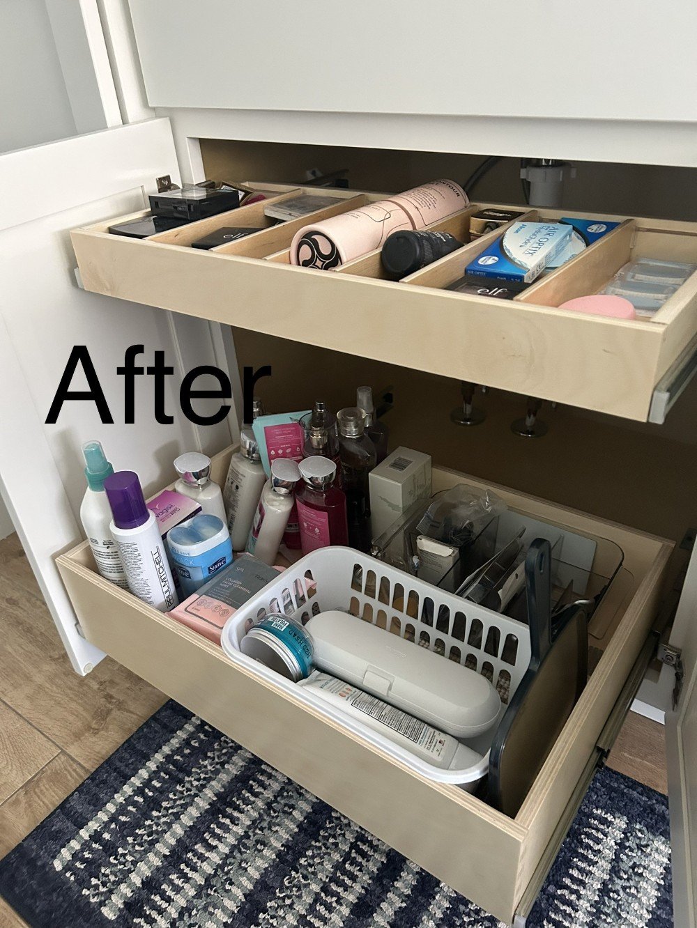 We installed 2 glide outs under this bathroom sink. A triple on bottom and a single with dividers on top. She stores her cosmetics in the upper. All she does now is pull it out and grab what she needs as she is getting dresses every morning.