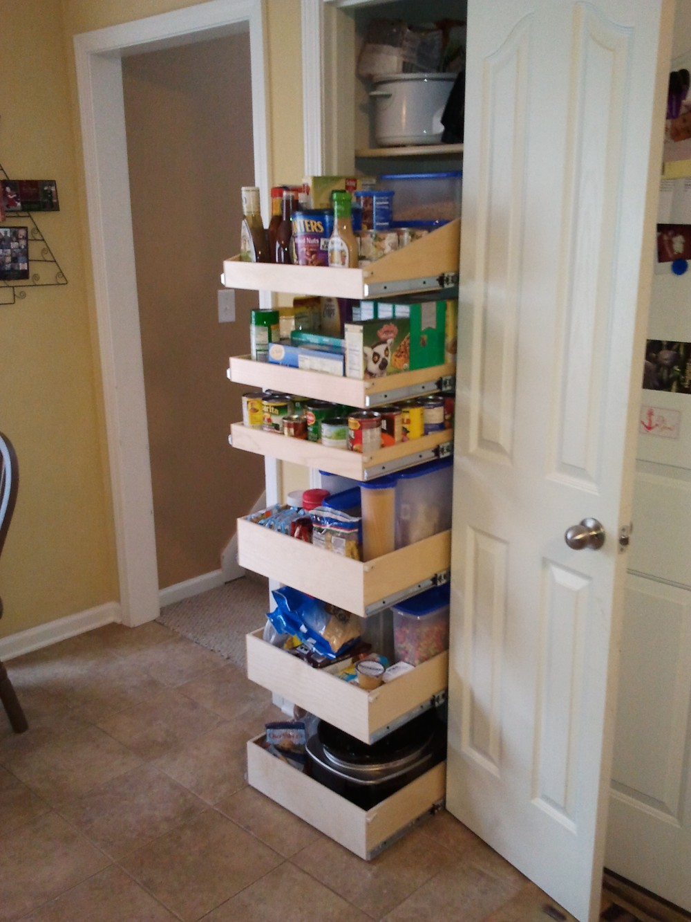 Throw away those wire shelves and update your pantry to have full-depth GlideOut shelves.