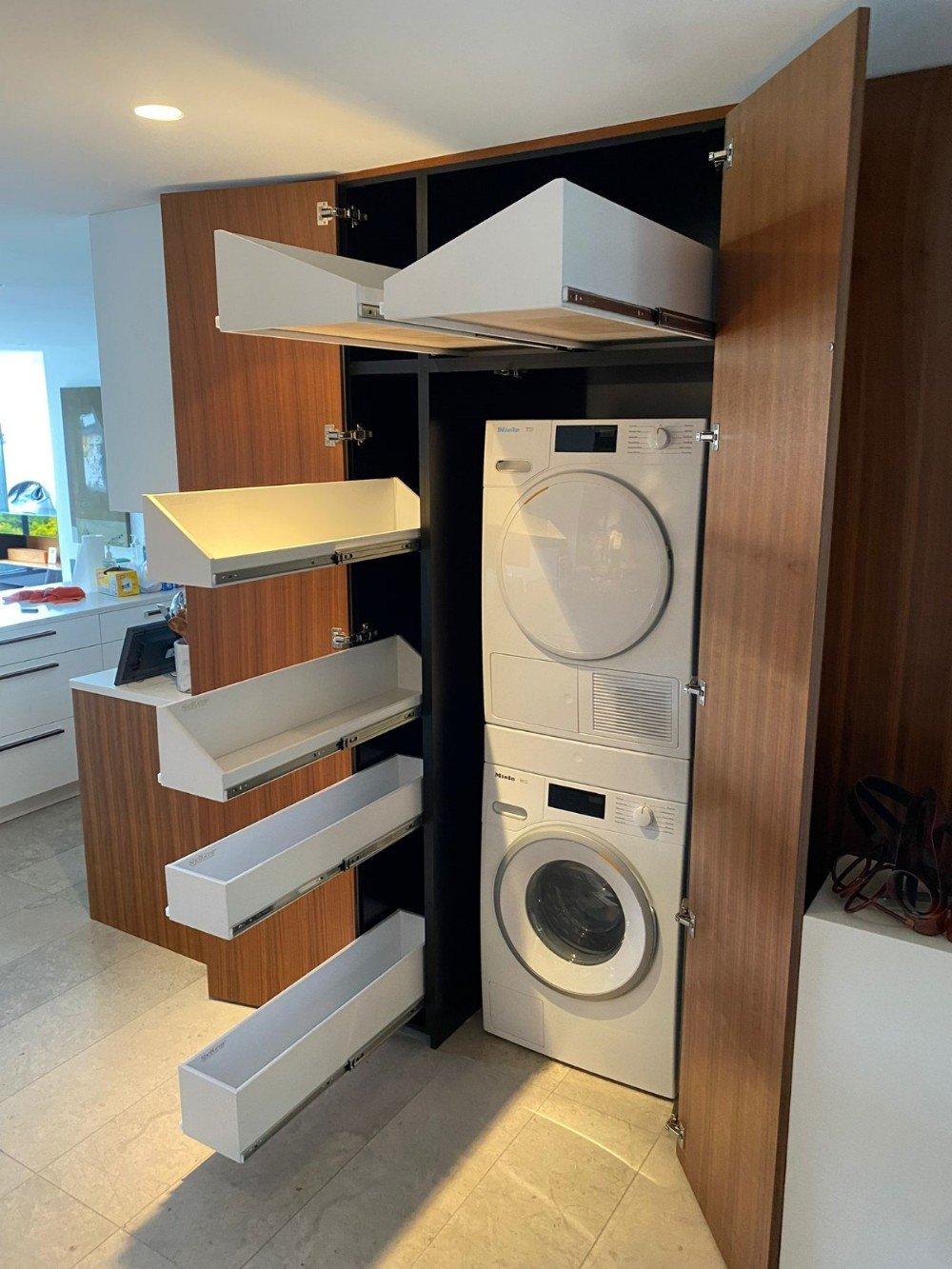 laundry room storage, laundry shelving, pull-out hampers, utility closet, cleaner storage