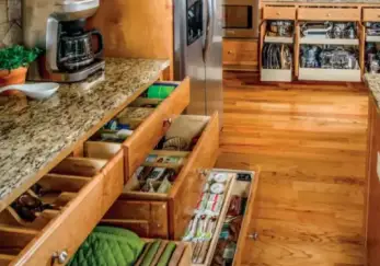 Kitchen with drawers pulled out to reveal shelving by ShelfGenie.