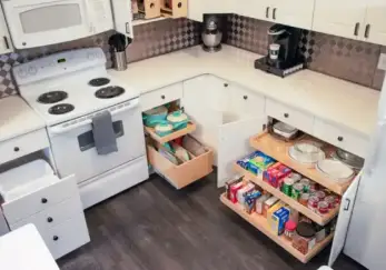 Kitchen with drawers pulled out and cabinets open to reveal shelving by ShelfGenie.