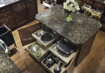 Kitchen with drawers pulled out and cabinets open to reveal shelving by ShelfGenie.