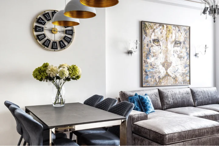 A living room with a couch and a table.