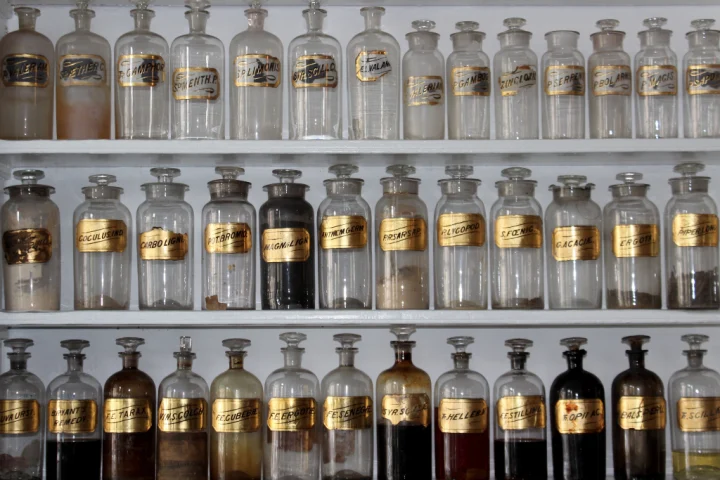 Jars of spices with gold labels.