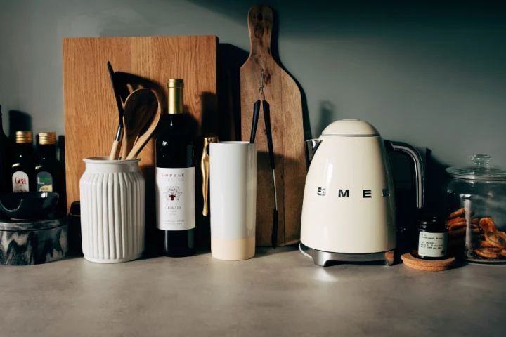 Kitchen countertop with cooking essentials and tools.
