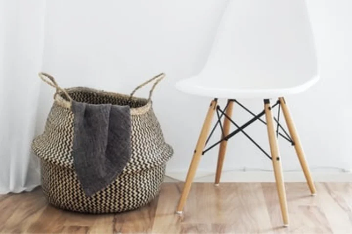Make use of spare woven basket as part of your laundry room storage ideas.