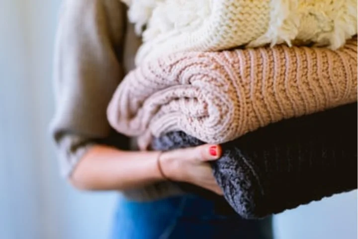 Organizing garments as part of your laundry room storage ideas.