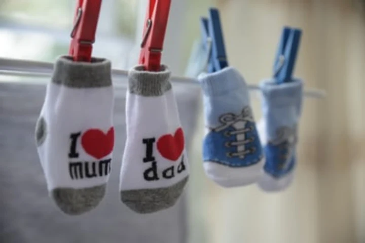 Socks on an indoor washing line.