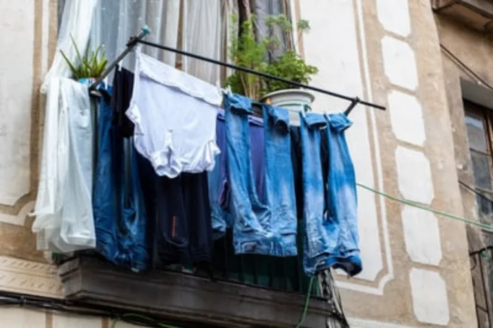 Outdoor mounted clothes rack for laundry room storage ideas.
