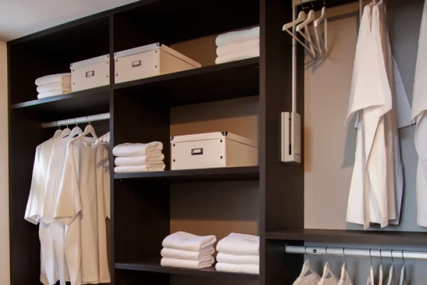 Open closet, spa clothes in closet, closet with no doors.