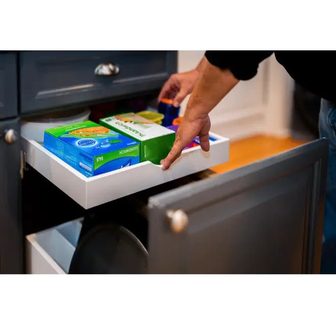 Pull out drawer with boxes inside.
